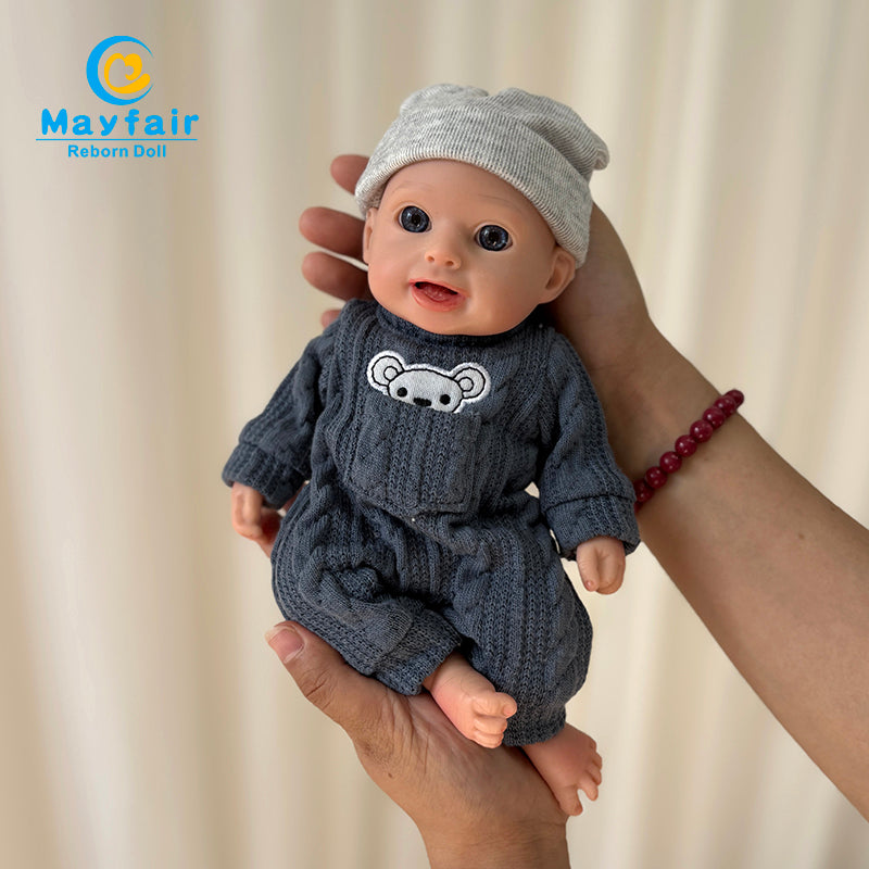 10 inch baby doll in hand