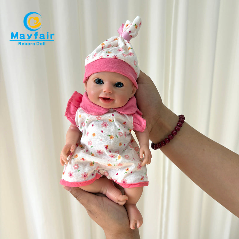 10 inch full silicone baby girl smiling in hands