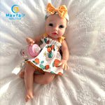 13 inch silicone baby doll in the bed