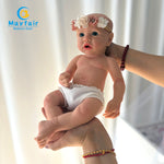 holding the full silicone reborn newborn doll in the arms