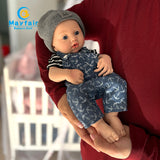 cute squishy silicone baby doll in arms