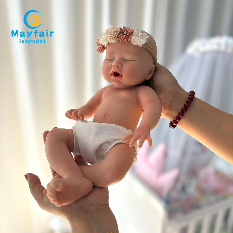 addorable 13 inch silicone baby doll holds in the hands